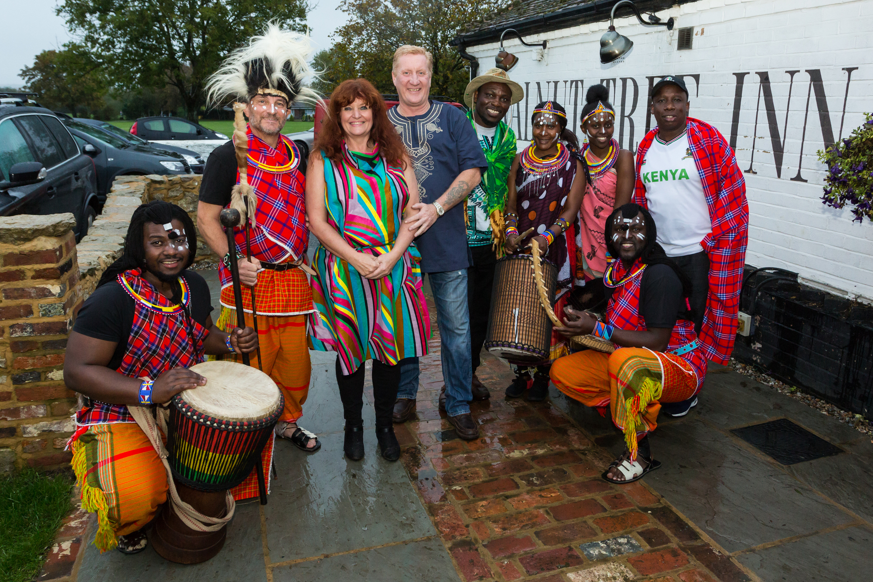 Licensee Karen Bartlett and partner Steve, centre, with some of the visiting Kenyans at the Walnut Tree in Aldington