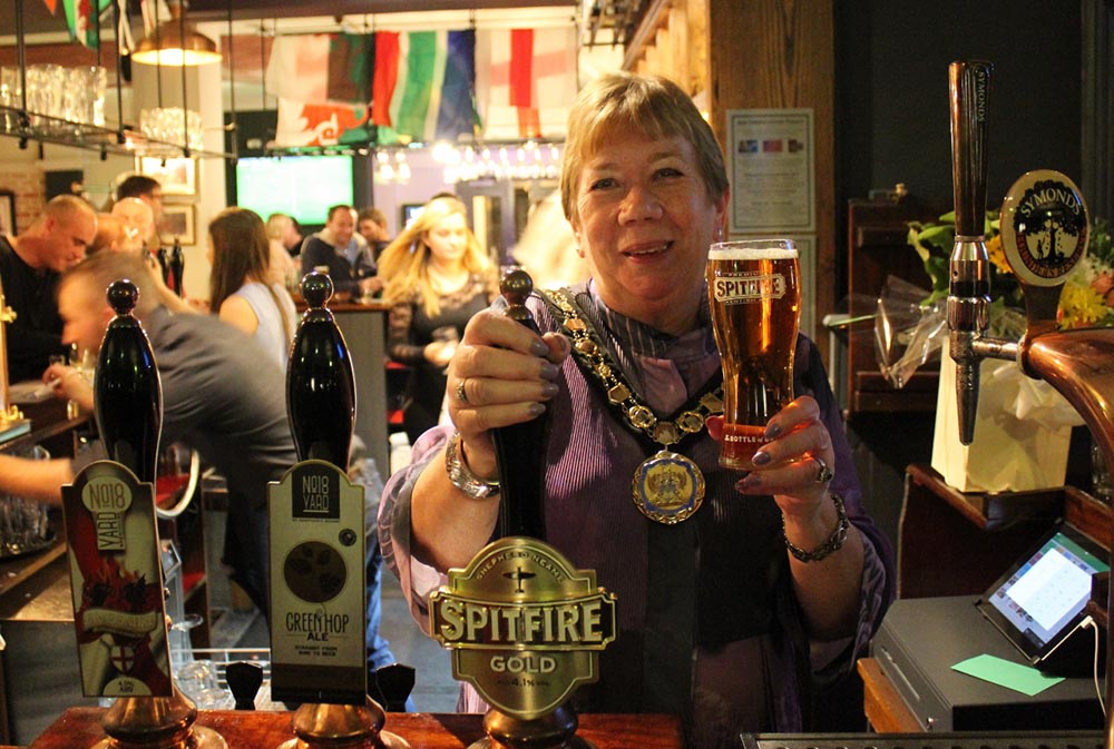 Mayor of Elmbridge Cllr Jan Fuller pulled the first pint at the Poyntz Arms East Molesey