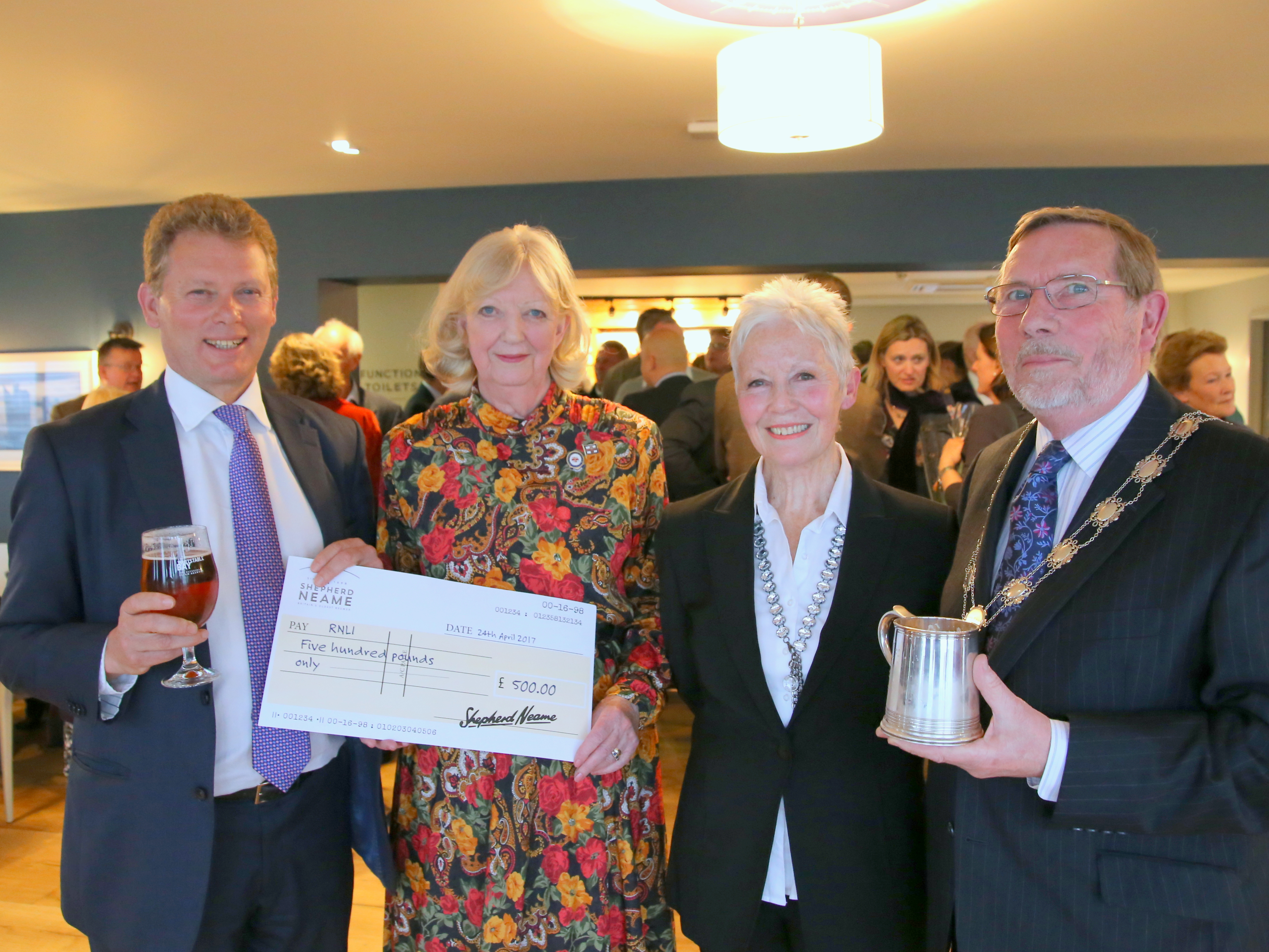 Jonathan Neame presents a cheque for the RNLI at the reopening of the Minnis Bay, with Fiz Gulliver-Crane of Birchington RNLI, Barbara Sturgeon and Cllr Neville Hudson