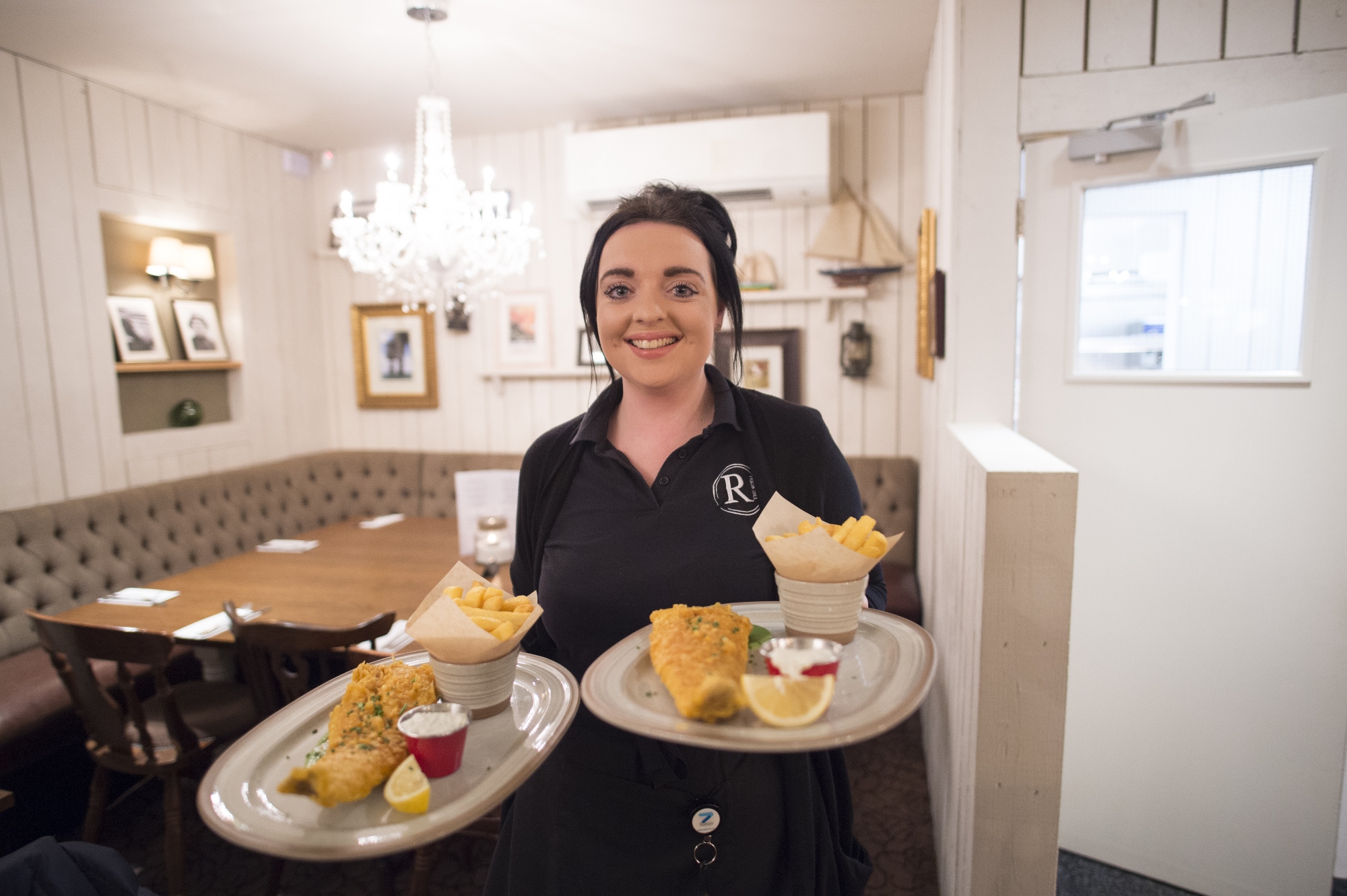 Waitress serves food at the new-look Royal, Tankerton