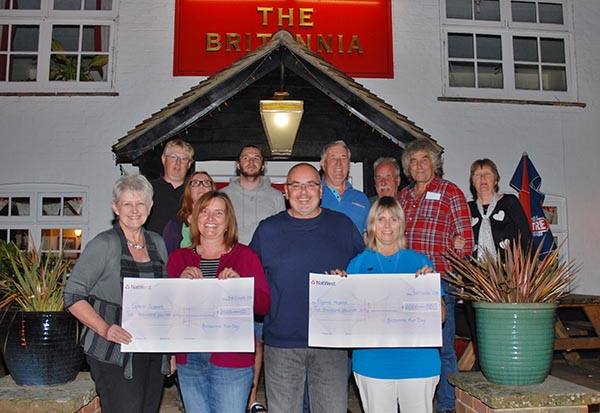 The Britannia Hythe - Sarah and Nigel Cooper present the charity cheques