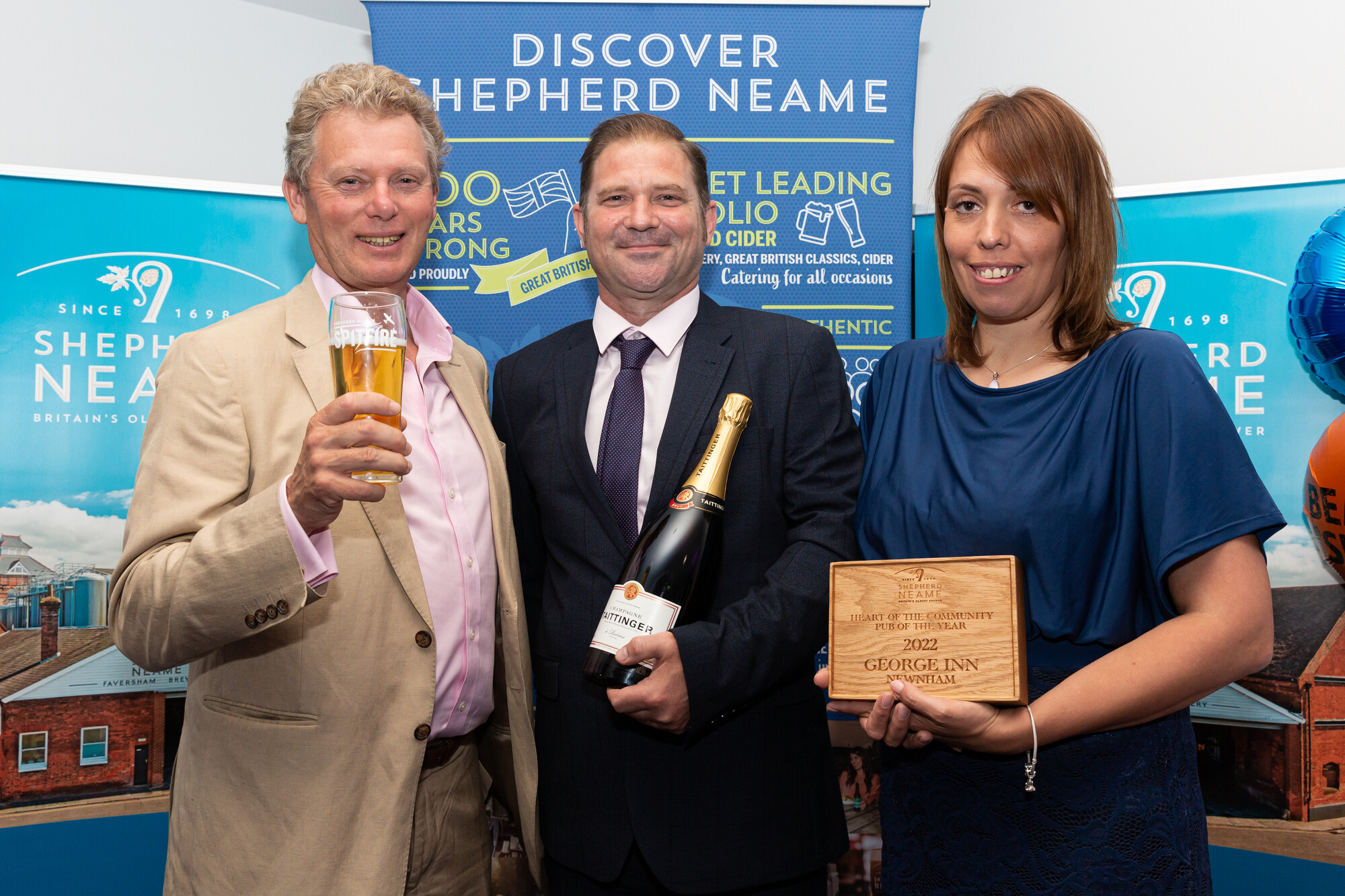 Licensees of the George Inn, Newnham, David and Claire Eliott with Chief Executive Jonathan Neame