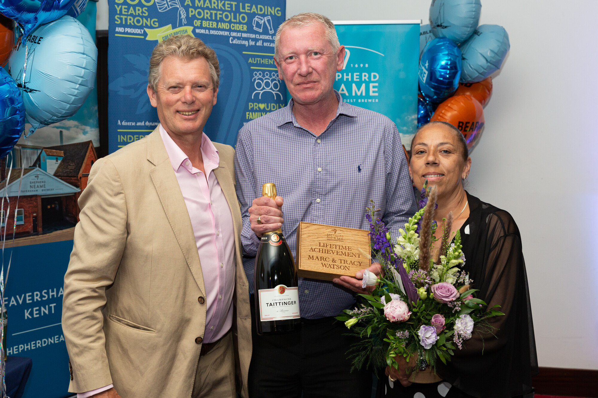 Licensees of the Wharf, Marc and Tracey Watson with Shepherd Neame Chief Executive Jonathan Neame